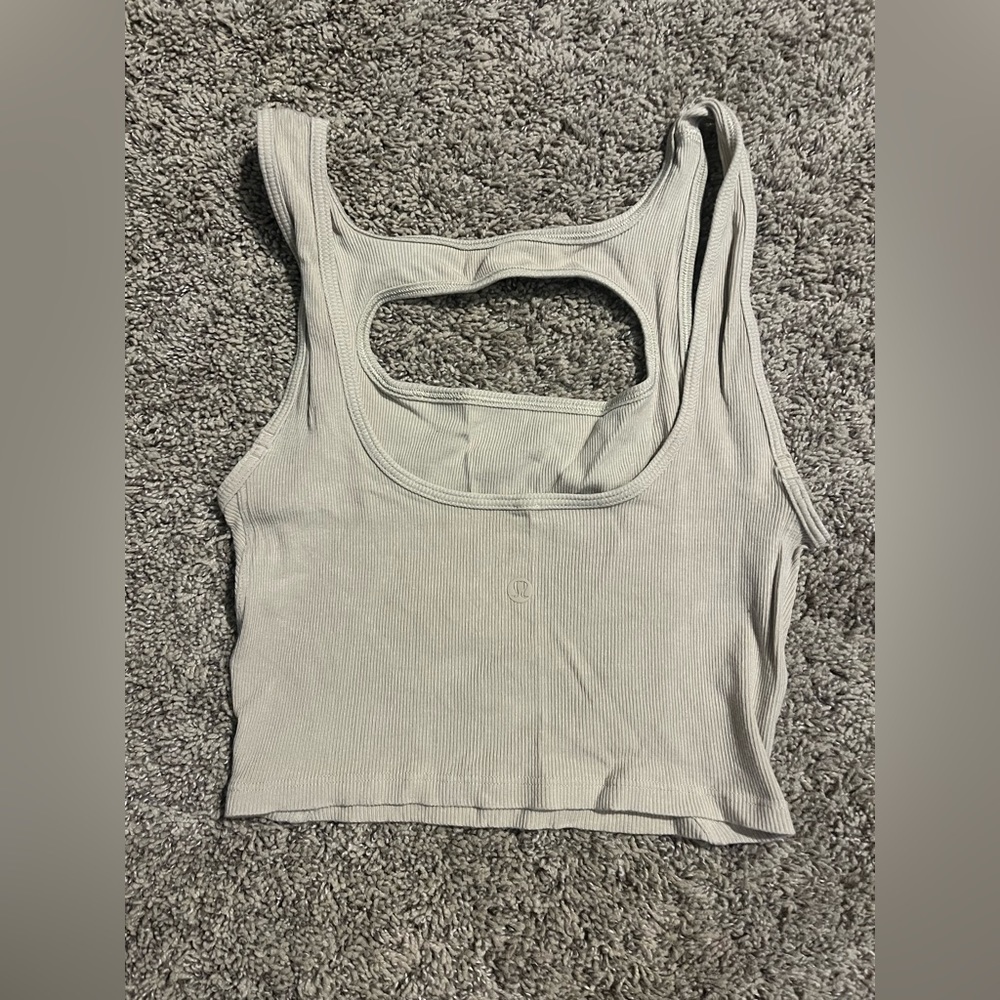 La front cut Lululemon crop tank with cutout chest. Size 4/6